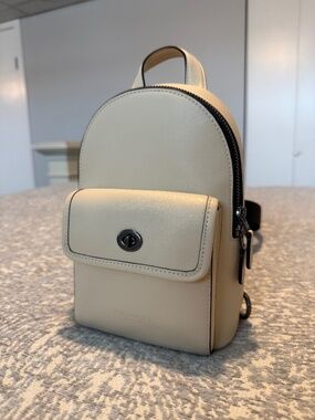 COACH Sling Backpack Ivory/Gunmetal
